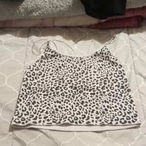 I'm selling a leopard crop-top that has 4 straps and 2 of them go across the bac